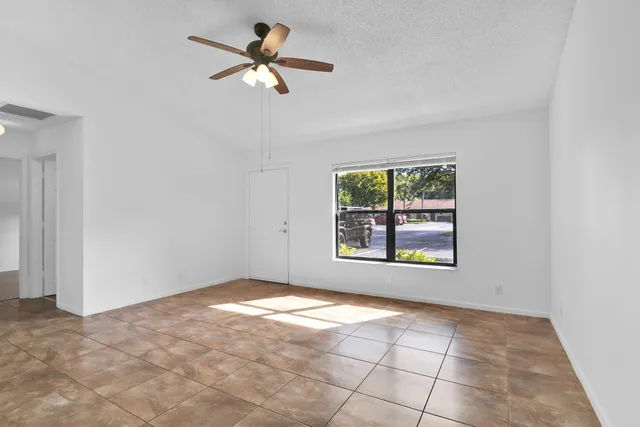 a view of an empty room with a window