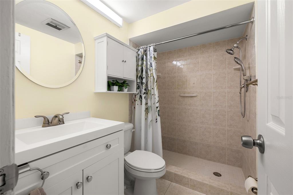 4239 Tamargo Drive New Port Richey, FL 34652 - Photo 16 of 26 a bathroom with a sink toilet and shower