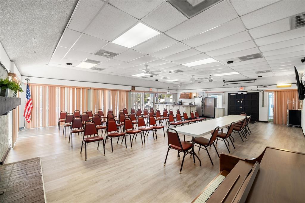 4239 Tamargo Drive New Port Richey, FL 34652 - Photo 25 of 26 a view of a dining room with furniture wooden floor and chandelier