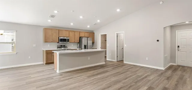 a white bath tub sitting next to a white sink