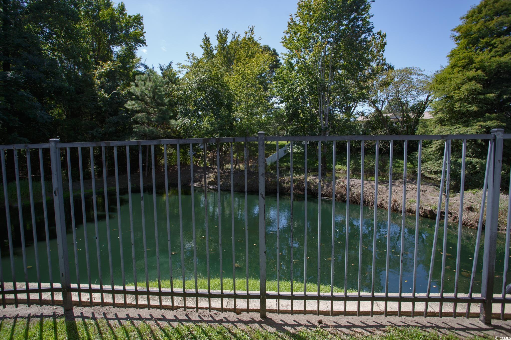 116 Barnacle Lane, Unit 1 Little River, SC 29566 - Photo 23 of 27 Gate featuring a balcony