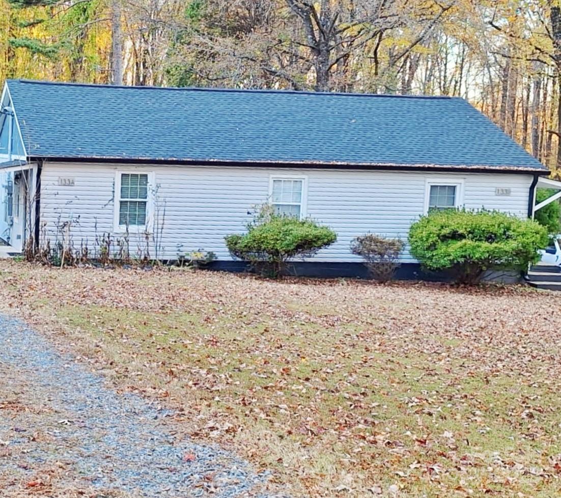 201 Hugh Caldwell Road Charlotte, NC 28214 - Photo 2 of 3 a front view of a house with garden