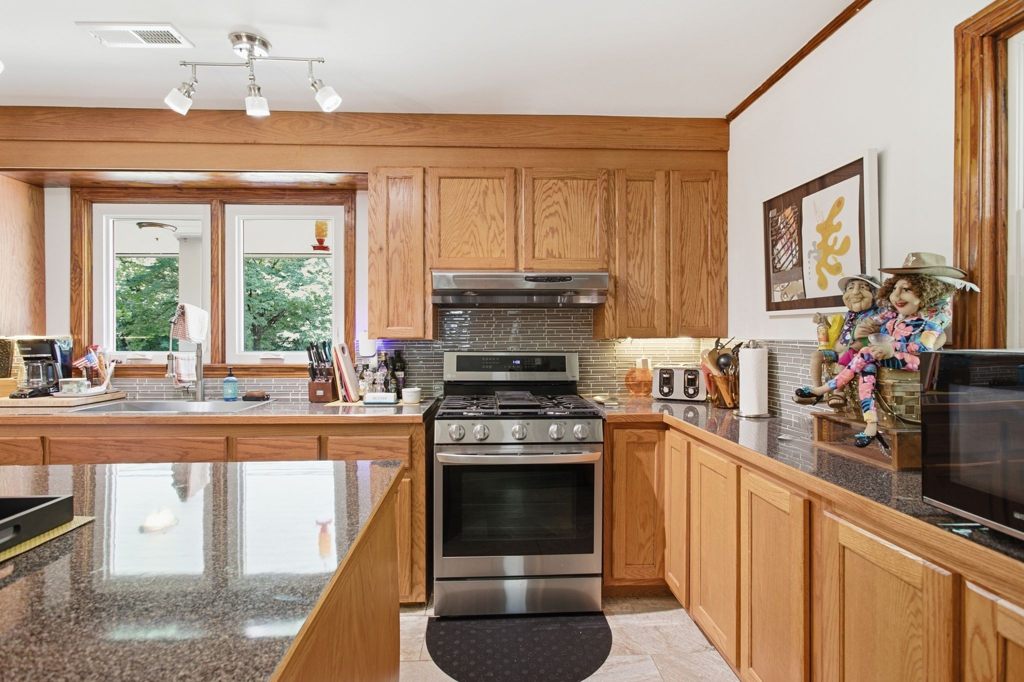 150 Toms Creek Road Linden, TN 37096 - Photo 3 of 23 a kitchen with a stove top oven and sink