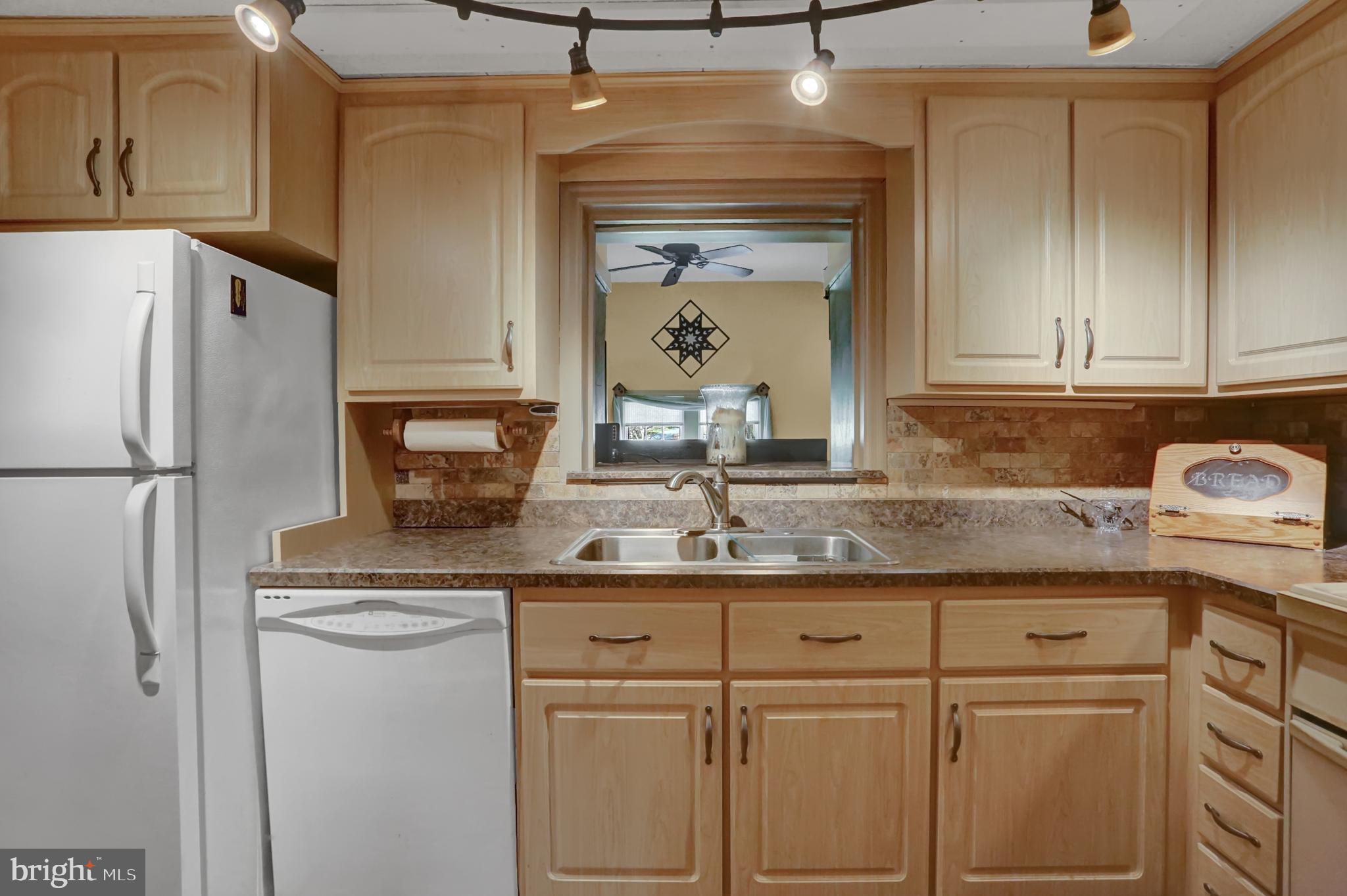 198 Eastbrook Road Smoketown, PA 17602 - Photo 12 of 35 a kitchen with kitchen island granite countertop cabinets and stainless steel appliances
