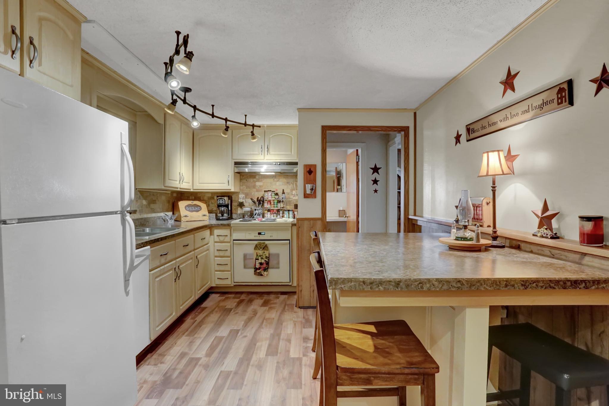 198 Eastbrook Road Smoketown, PA 17602 - Photo 16 of 35 a kitchen with stainless steel appliances granite countertop a sink stove and refrigerator