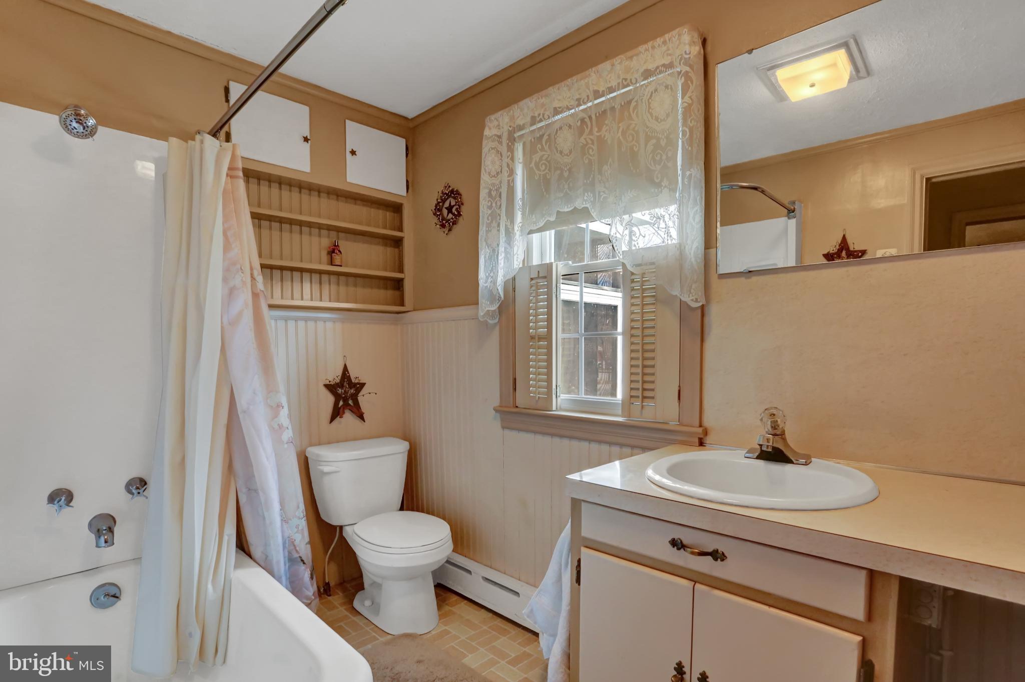 198 Eastbrook Road Smoketown, PA 17602 - Photo 23 of 35 a bathroom with a toilet a sink and a mirror