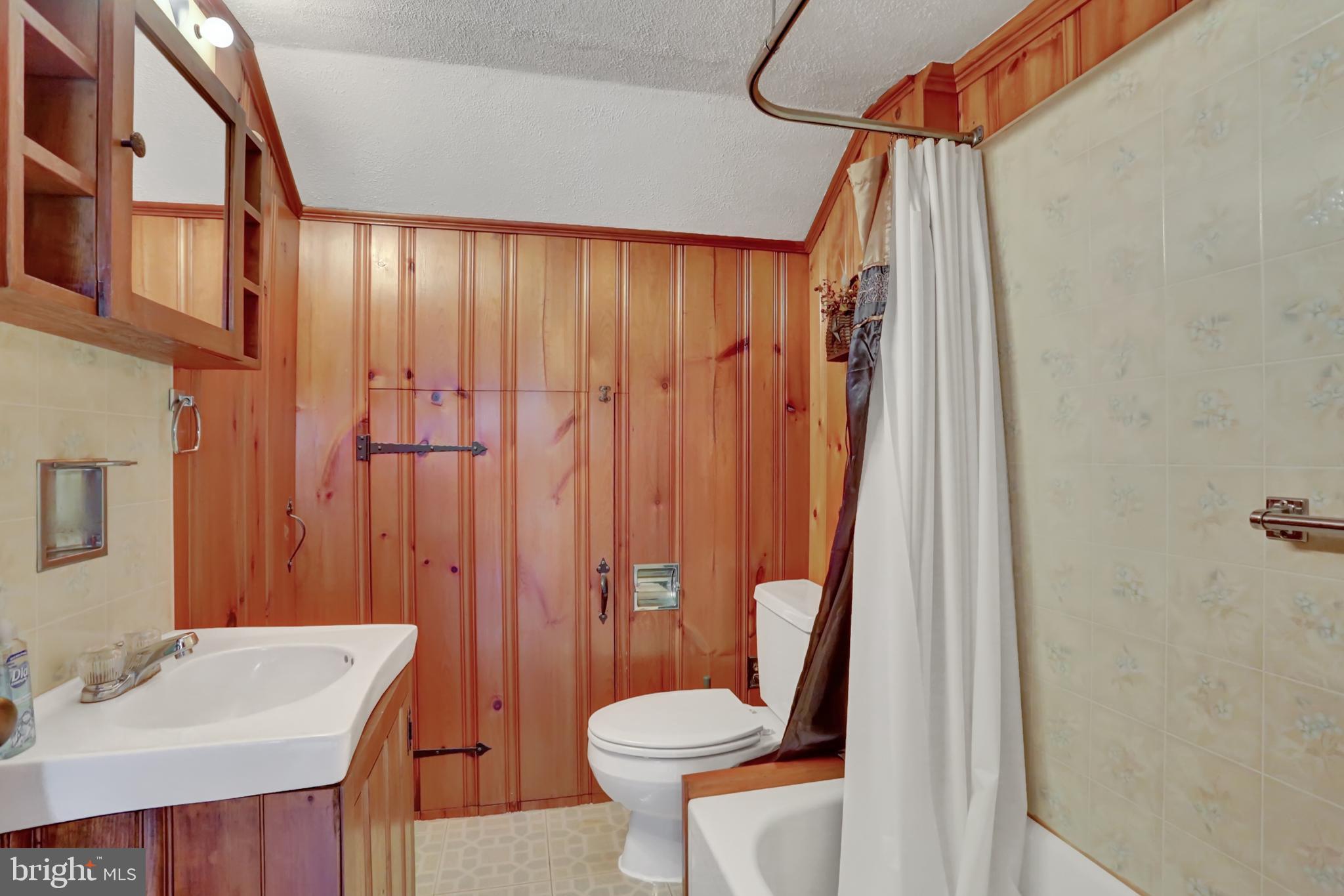 198 Eastbrook Road Smoketown, PA 17602 - Photo 24 of 35 a bathroom with a sink a toilet and shower curtain