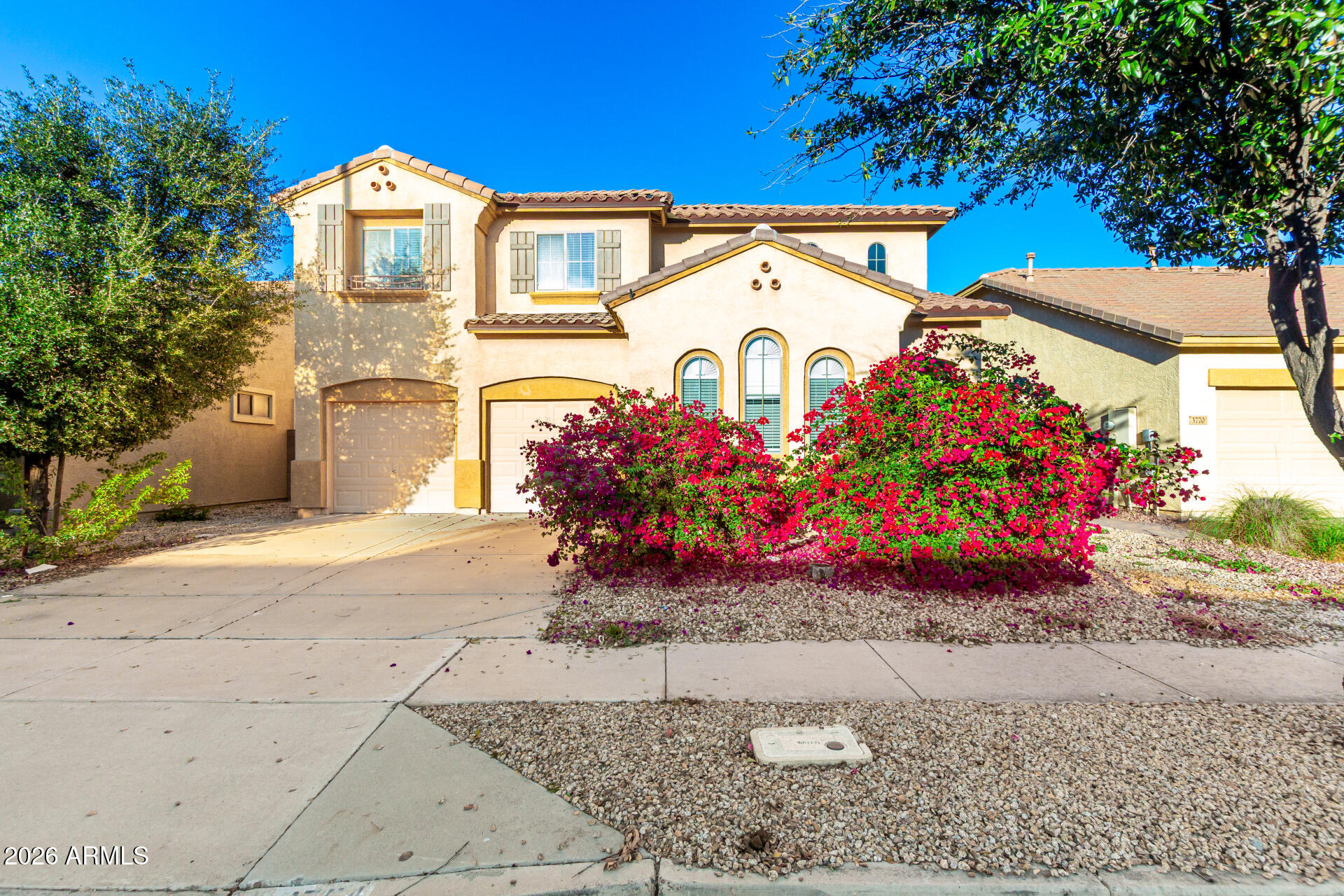 a view of a street with potted plants