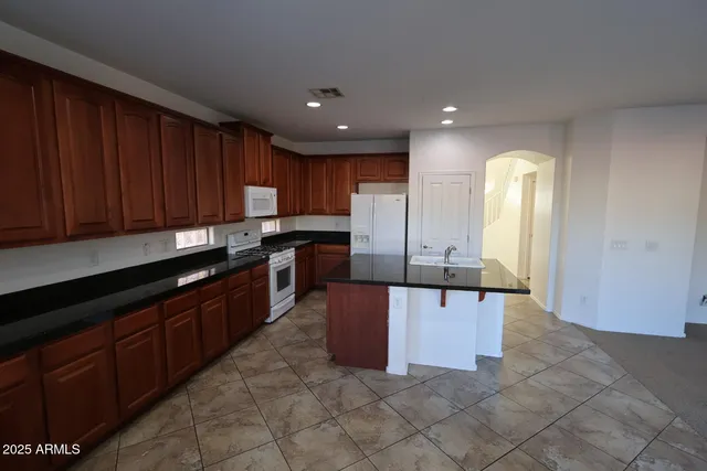 a bathroom with a sink double vanity and a mirror