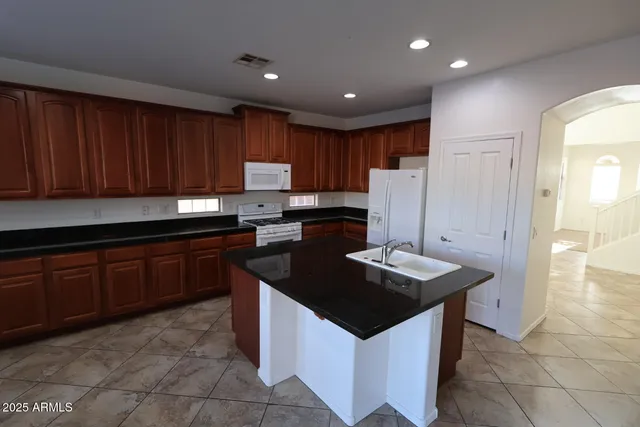 a view of a chandelier fan and a table