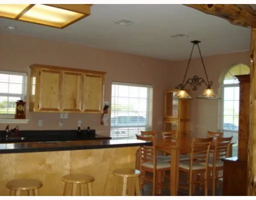 a bathroom with a tub a sink and a large mirror