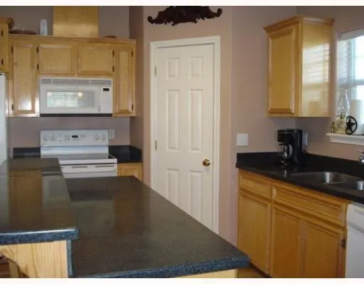 a bathroom with a sink a mirror and a bathtub