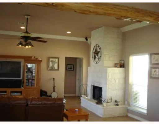a living room with fireplace furniture and a flat screen tv