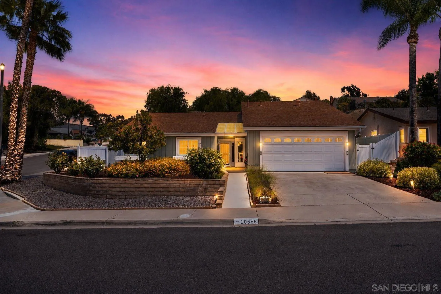 10565 Strathmore Drive Santee, CA 92071 - Photo 49 of 59 a front view of a house with a garden
