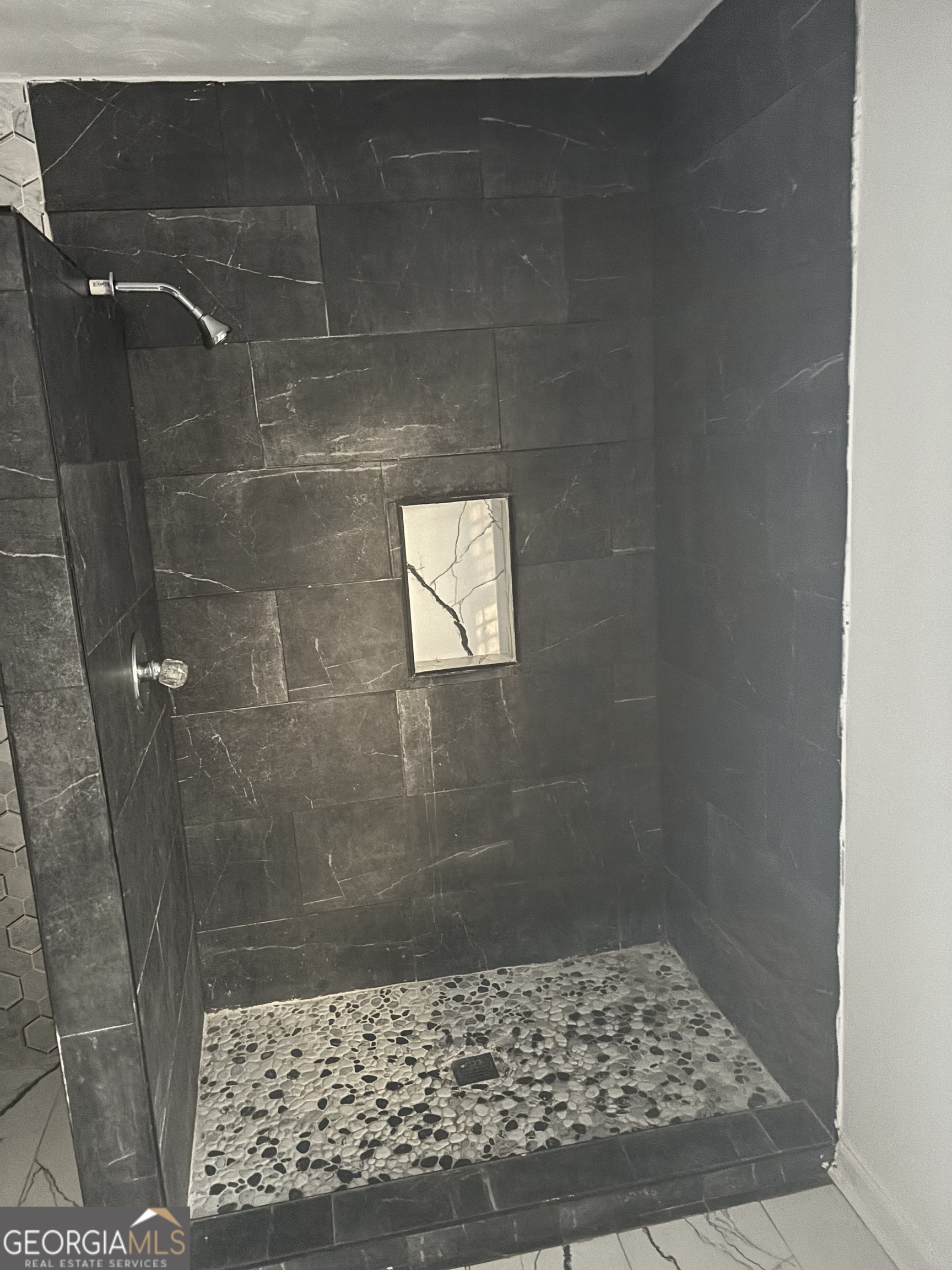 614 Alfred C Carson Street Sandersville, GA 31082 - Photo 19 of 22 a bathroom with a shower