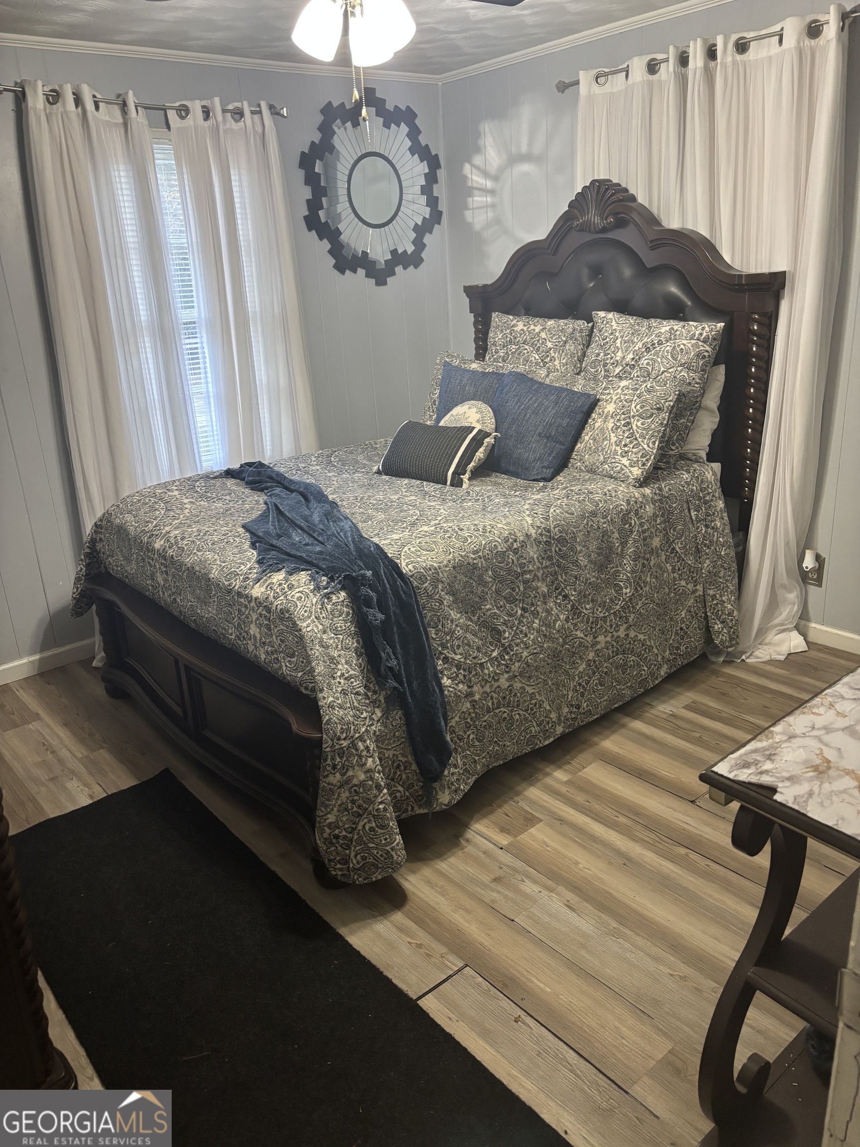 614 Alfred C Carson Street Sandersville, GA 31082 - Photo 2 of 22 a bedroom with a bed and a window