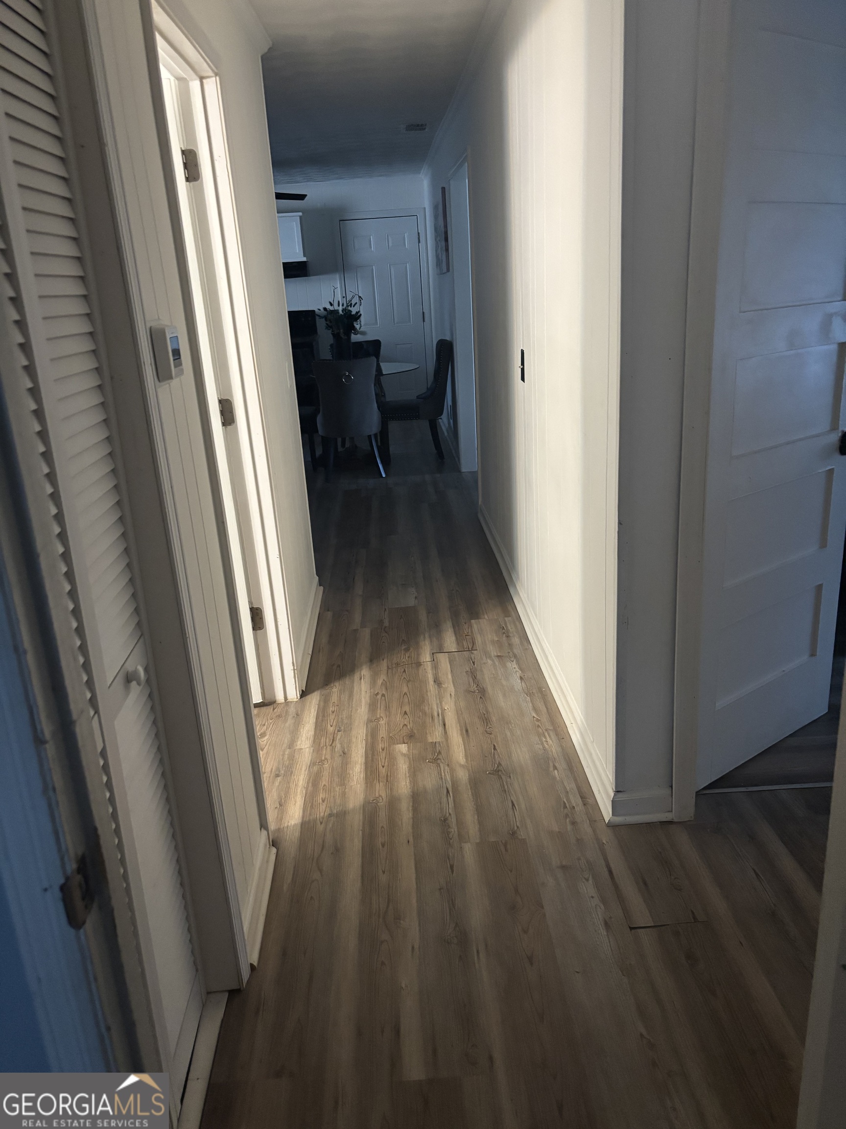 614 Alfred C Carson Street Sandersville, GA 31082 - Photo 5 of 22 a view of a hallway and wooden floor