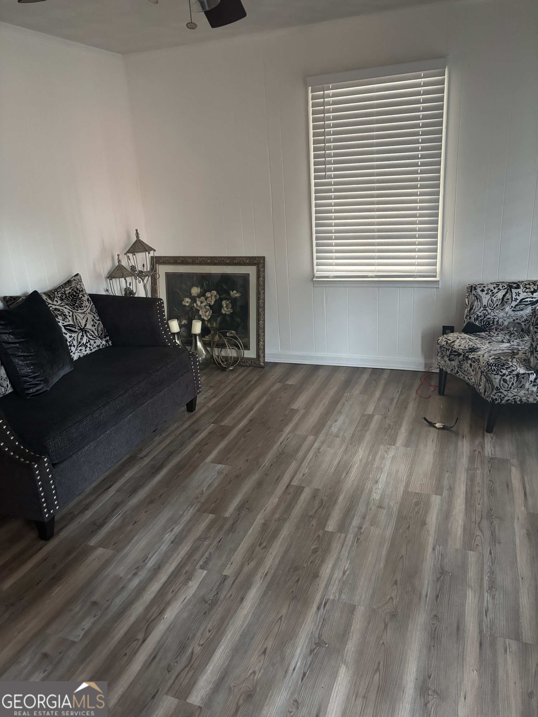 614 Alfred C Carson Street Sandersville, GA 31082 - Photo 8 of 22 a living room with furniture and a hard wood floor