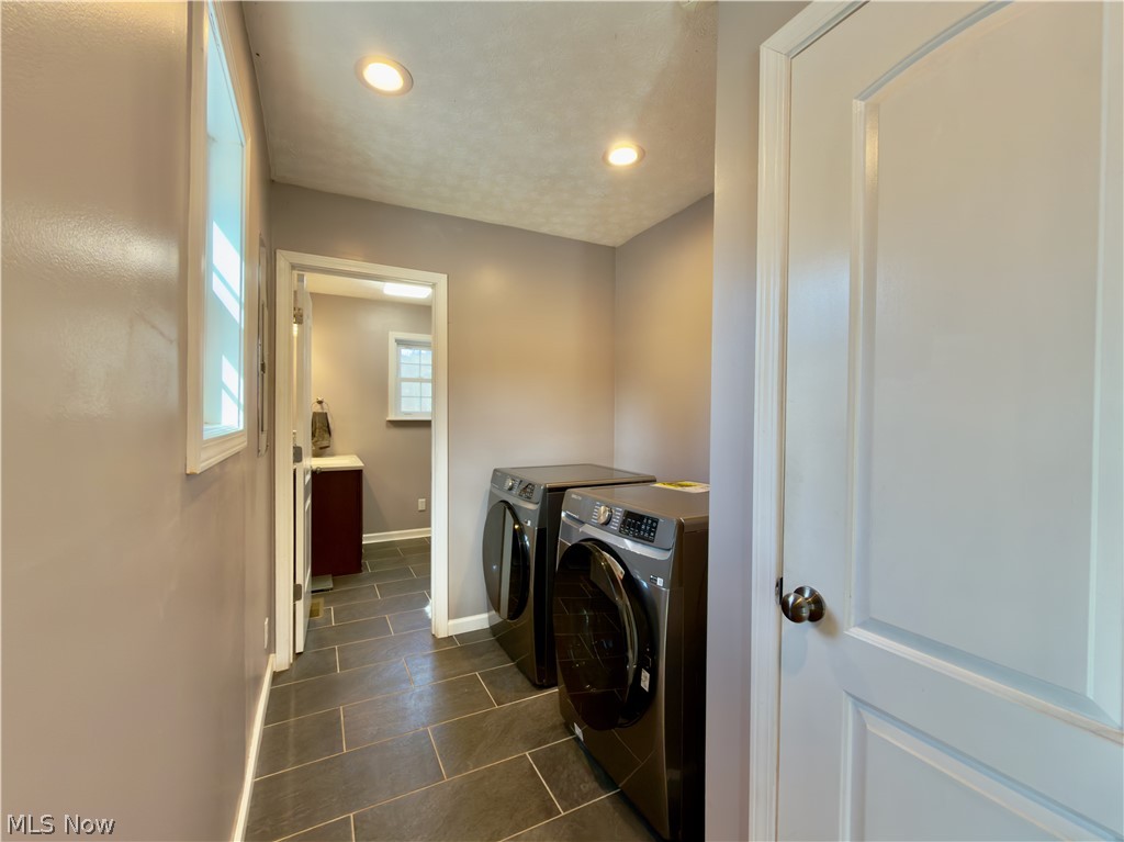 17377 Murphy Road Amesville, OH 45711 - Photo 15 of 43 Laundry room featuring washing machine and dryer, recessed lighting, and dark tile patterned floors