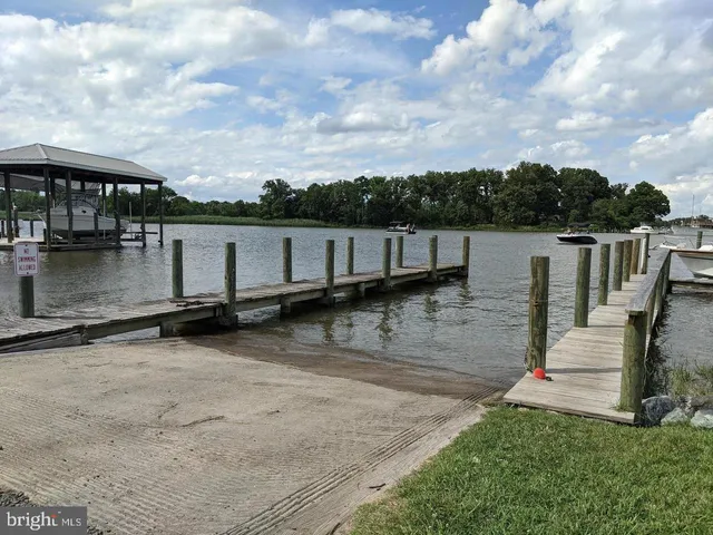 a view of a house next to a lake