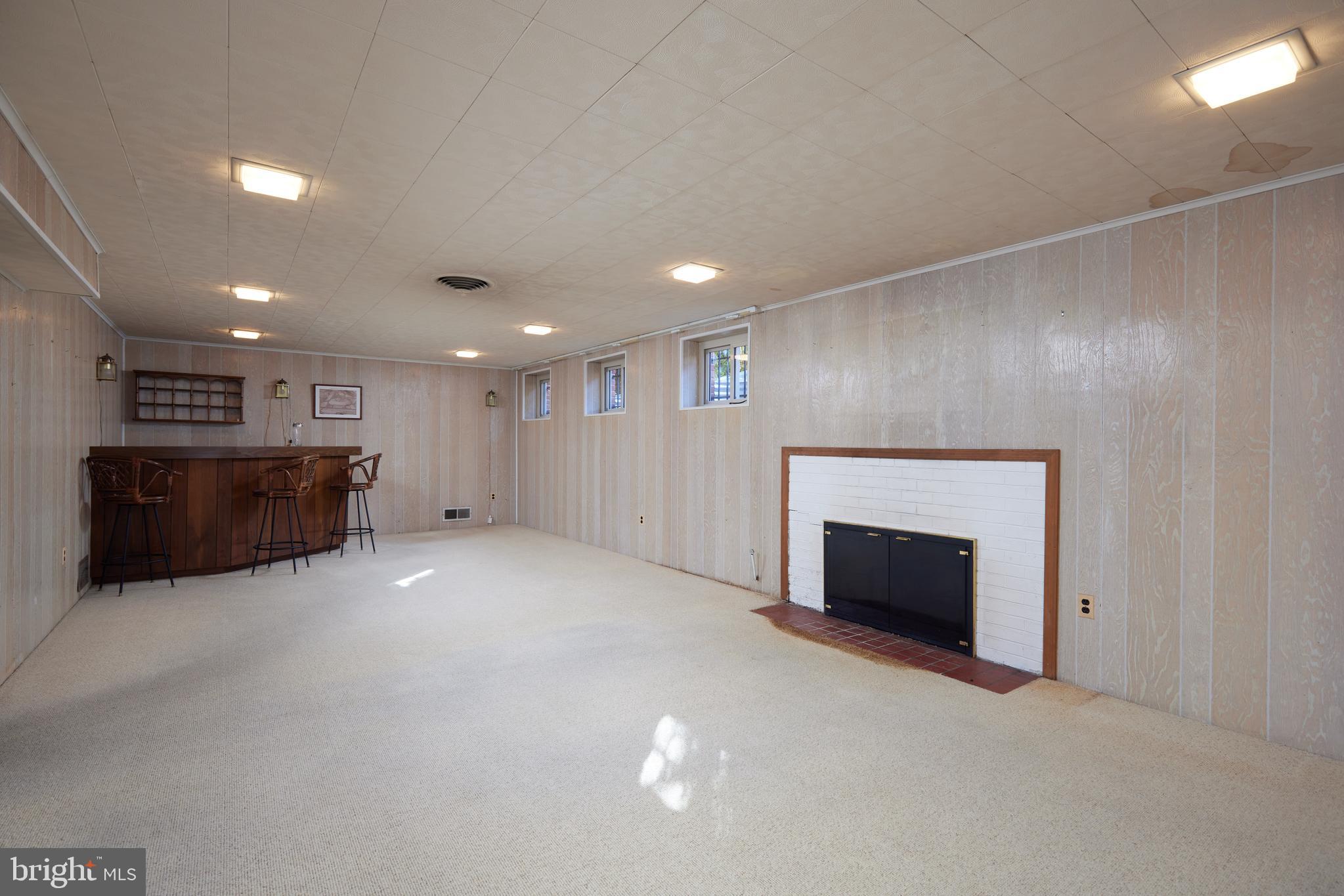 5505 Uppingham Street Chevy Chase, MD 20815 - Photo 17 of 28 Large Family Room with a Fireplace