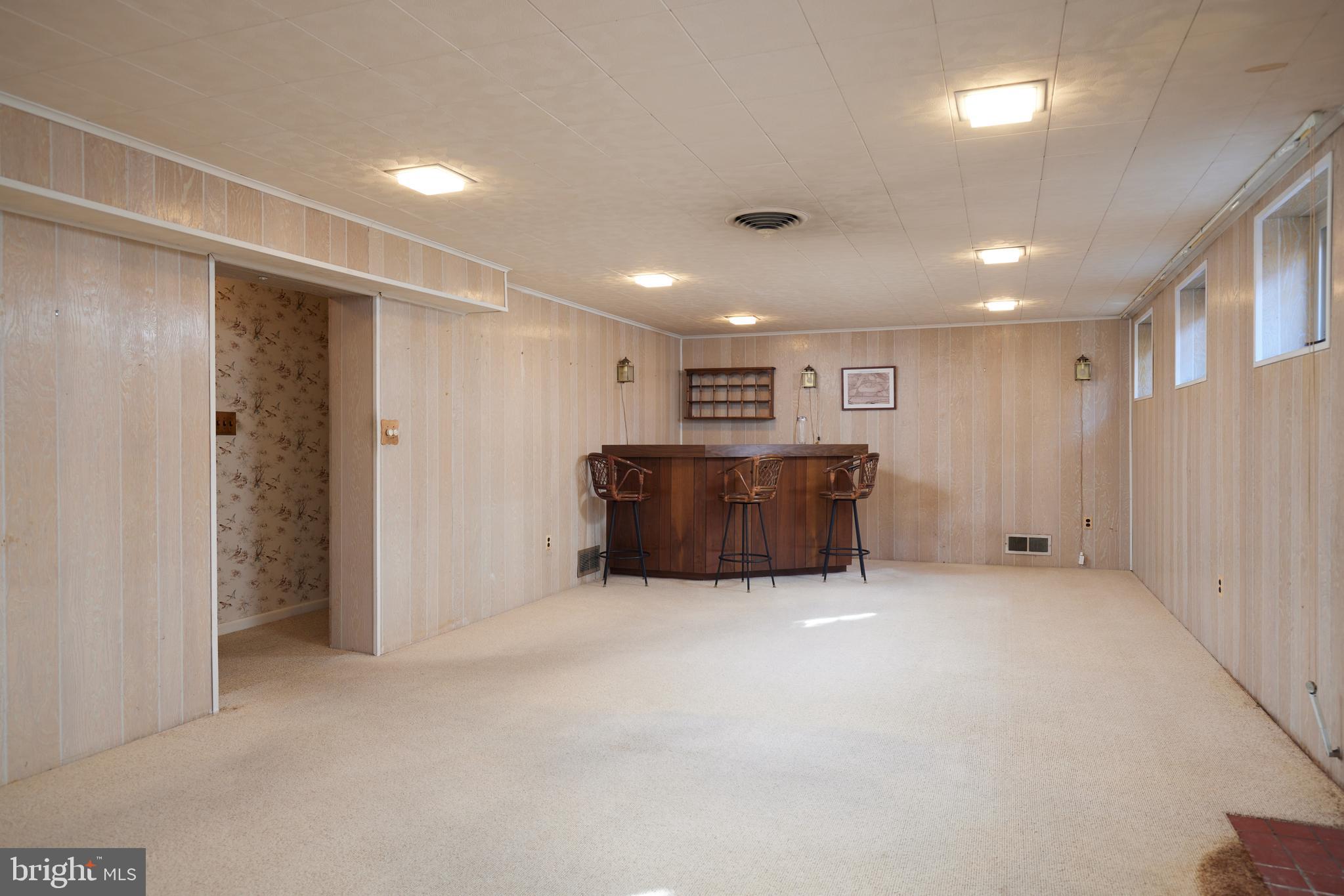 5505 Uppingham Street Chevy Chase, MD 20815 - Photo 18 of 28 Family Room with a 1950's Bar