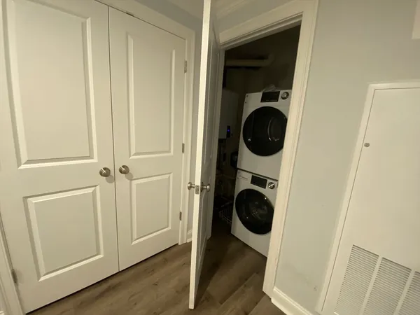 a view of a hallway with washer and dryer