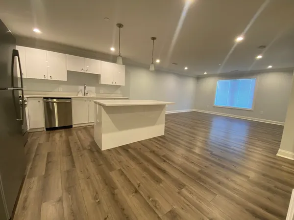 a view of kitchen with cabinets
