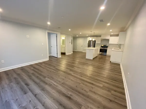 a view of kitchen and kitchen with sink