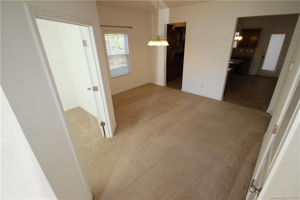 10603 Pointer Ridge Drive Charlotte, NC 28214 - Photo 2 of 37 a view of a hallway with wooden floor and entryway