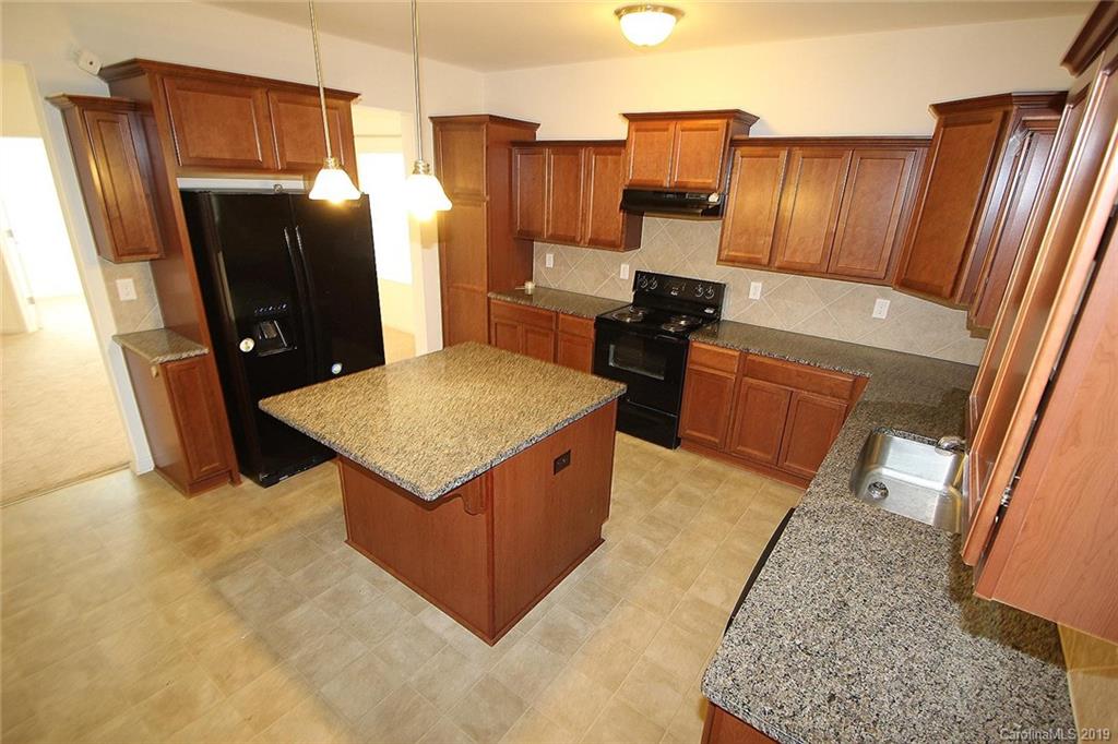 10603 Pointer Ridge Drive Charlotte, NC 28214 - Photo 12 of 37 a kitchen with stainless steel appliances granite countertop a refrigerator and a sink