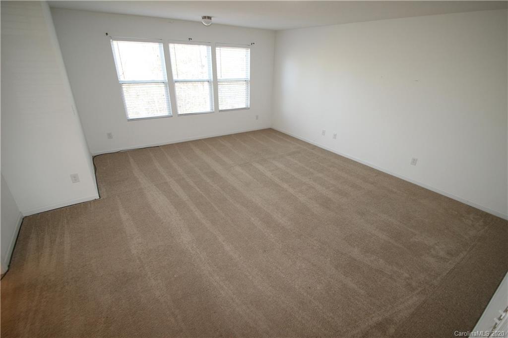 10603 Pointer Ridge Drive Charlotte, NC 28214 - Photo 18 of 37 an empty room with a window