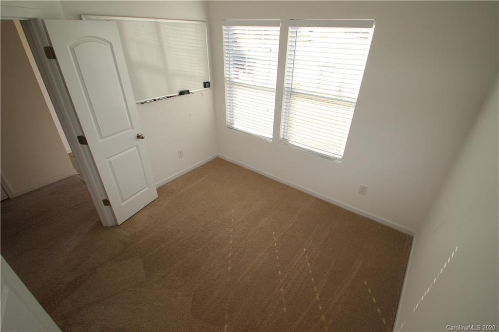 10603 Pointer Ridge Drive Charlotte, NC 28214 - Photo 3 of 37 an empty room with windows
