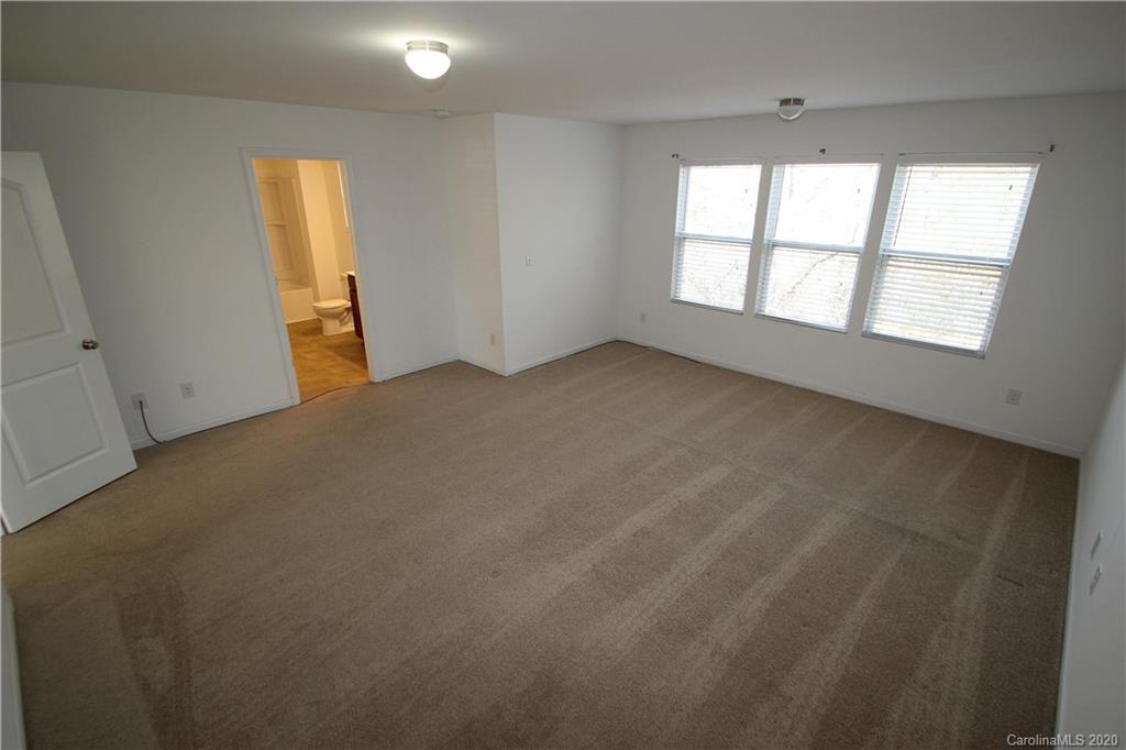 10603 Pointer Ridge Drive Charlotte, NC 28214 - Photo 21 of 37 an empty room with windows