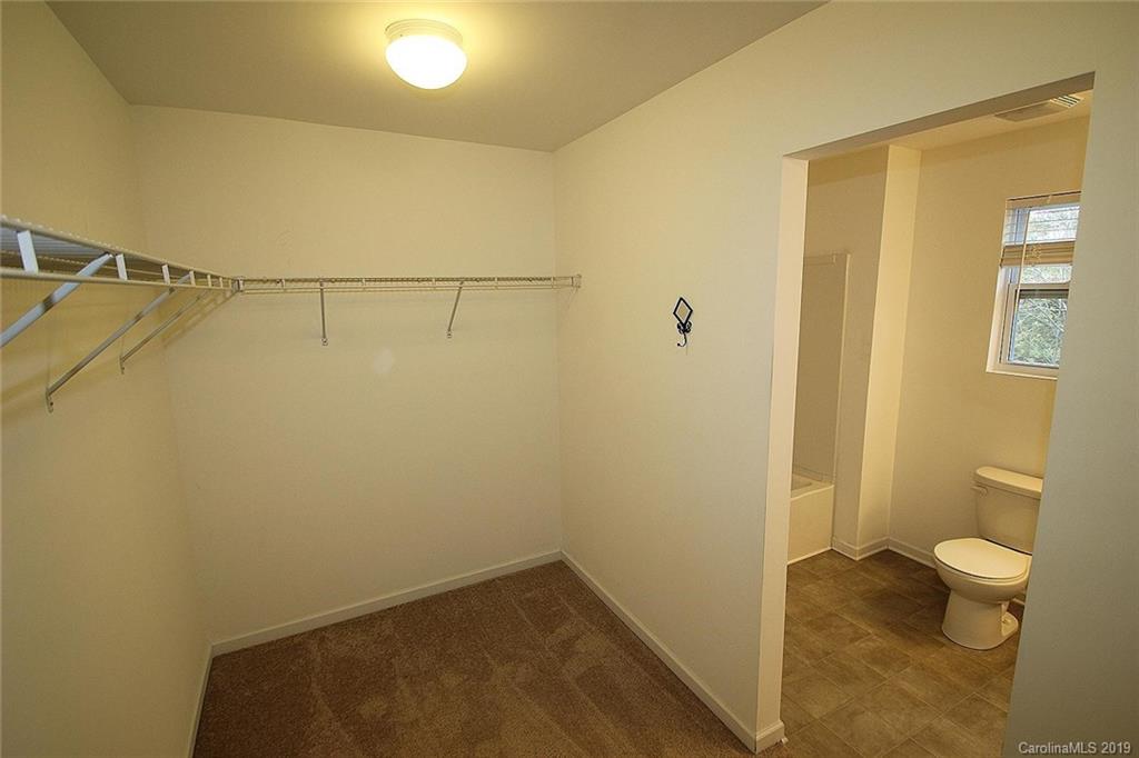 10603 Pointer Ridge Drive Charlotte, NC 28214 - Photo 23 of 37 a bathroom with a shower and a toilet