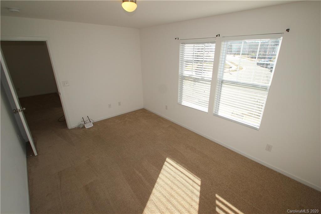 10603 Pointer Ridge Drive Charlotte, NC 28214 - Photo 25 of 37 a view of an empty room with a window