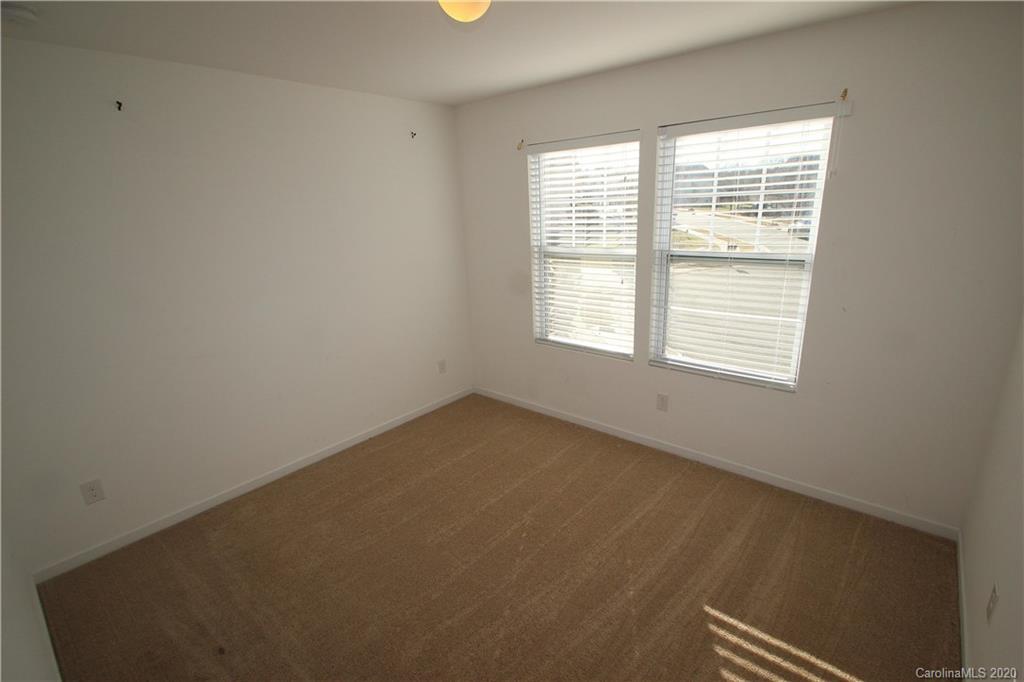 10603 Pointer Ridge Drive Charlotte, NC 28214 - Photo 28 of 37 an empty room with a window