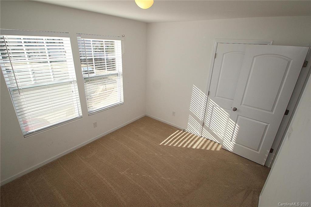 10603 Pointer Ridge Drive Charlotte, NC 28214 - Photo 30 of 37 a view of an empty room with a window