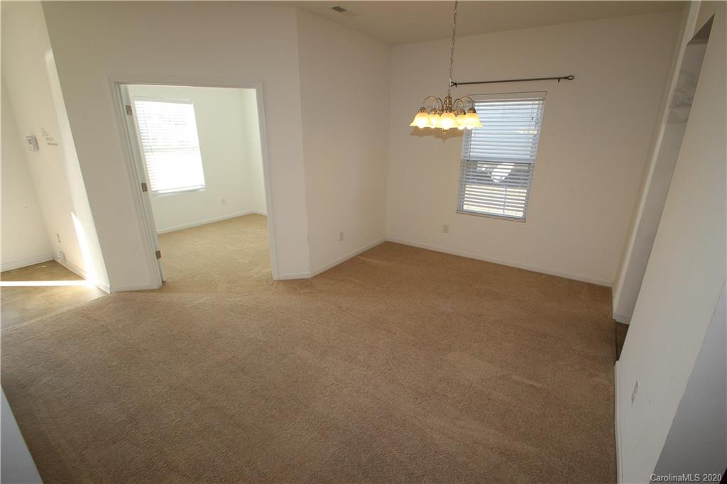 10603 Pointer Ridge Drive Charlotte, NC 28214 - Photo 4 of 37 a view of a room with an empty space and a window