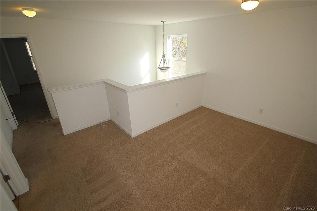10603 Pointer Ridge Drive Charlotte, NC 28214 - Photo 32 of 37 an empty room with windows