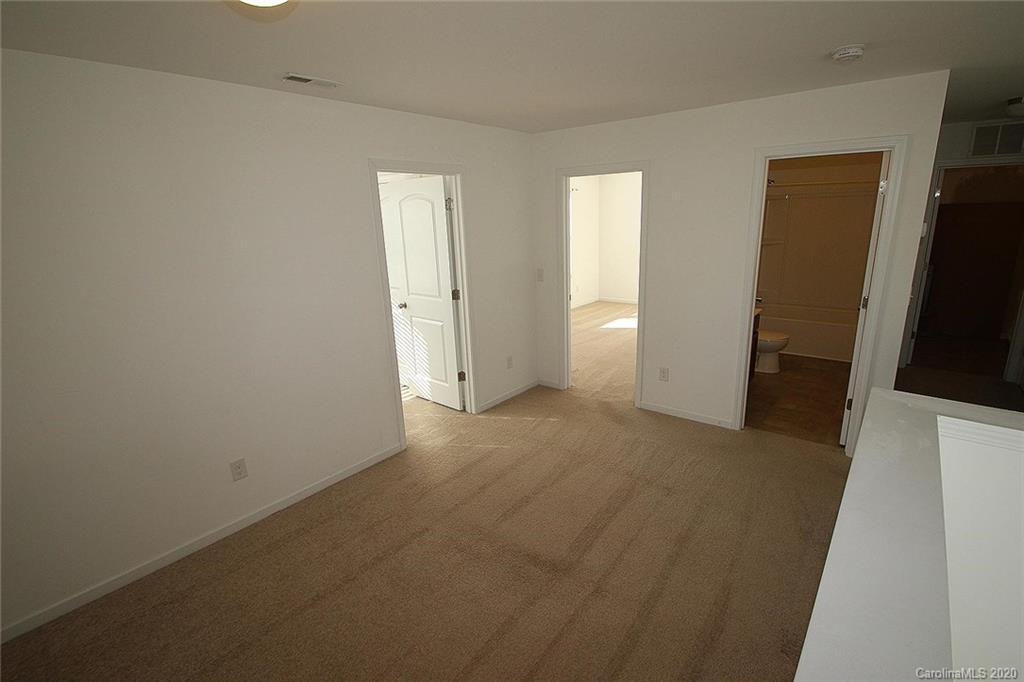 10603 Pointer Ridge Drive Charlotte, NC 28214 - Photo 34 of 37 an empty room with windows