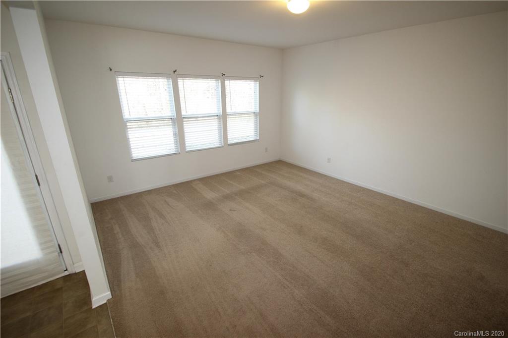 10603 Pointer Ridge Drive Charlotte, NC 28214 - Photo 6 of 37 an empty room with windows
