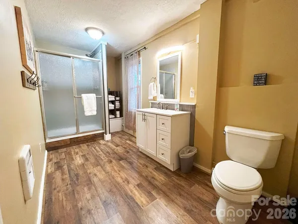 a balcony with furniture and wooden floor