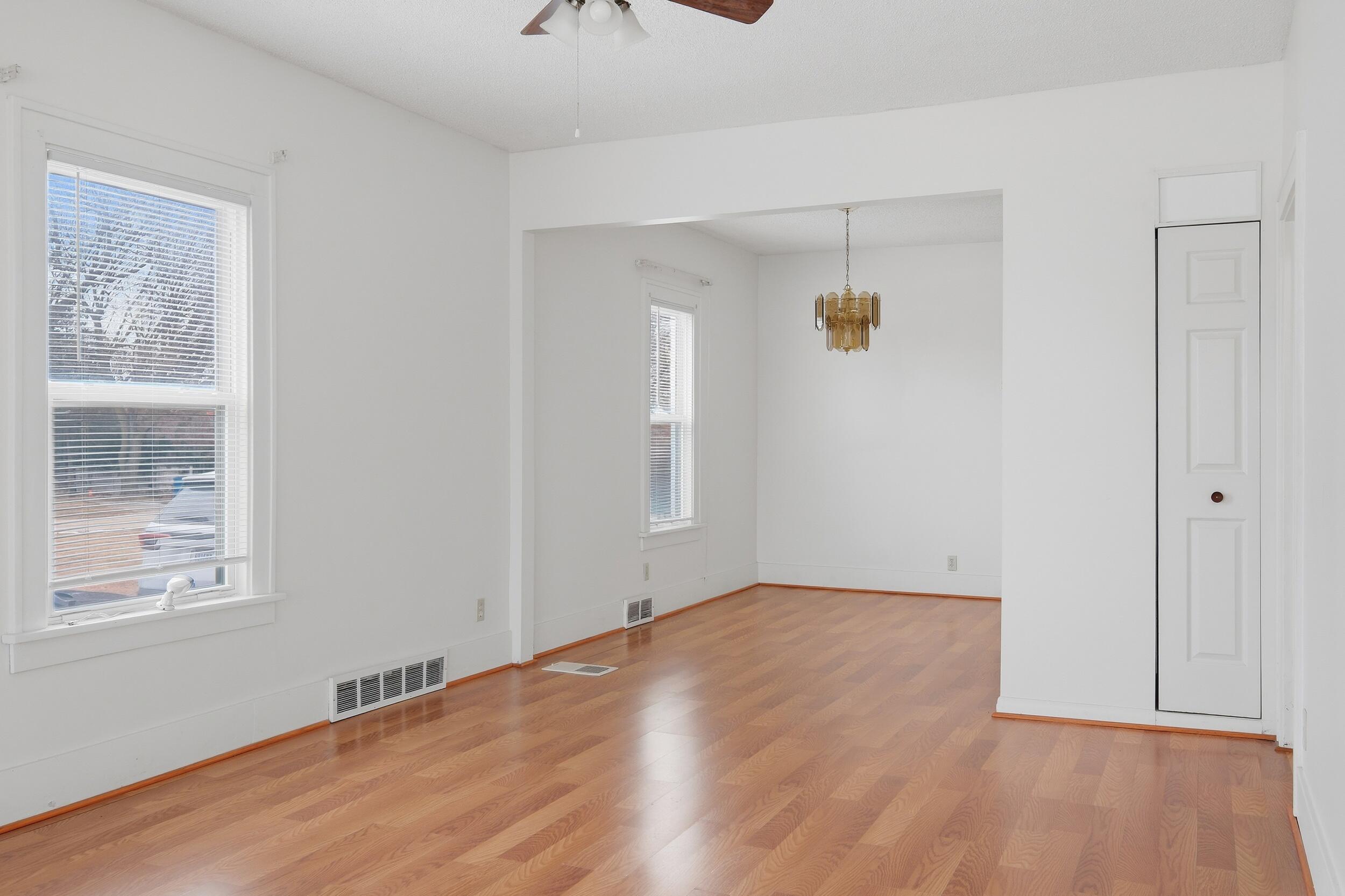 2418 Ridge Road Highland, IN 46322 - Photo 11 of 44 a view of an empty room with wooden floor and a window