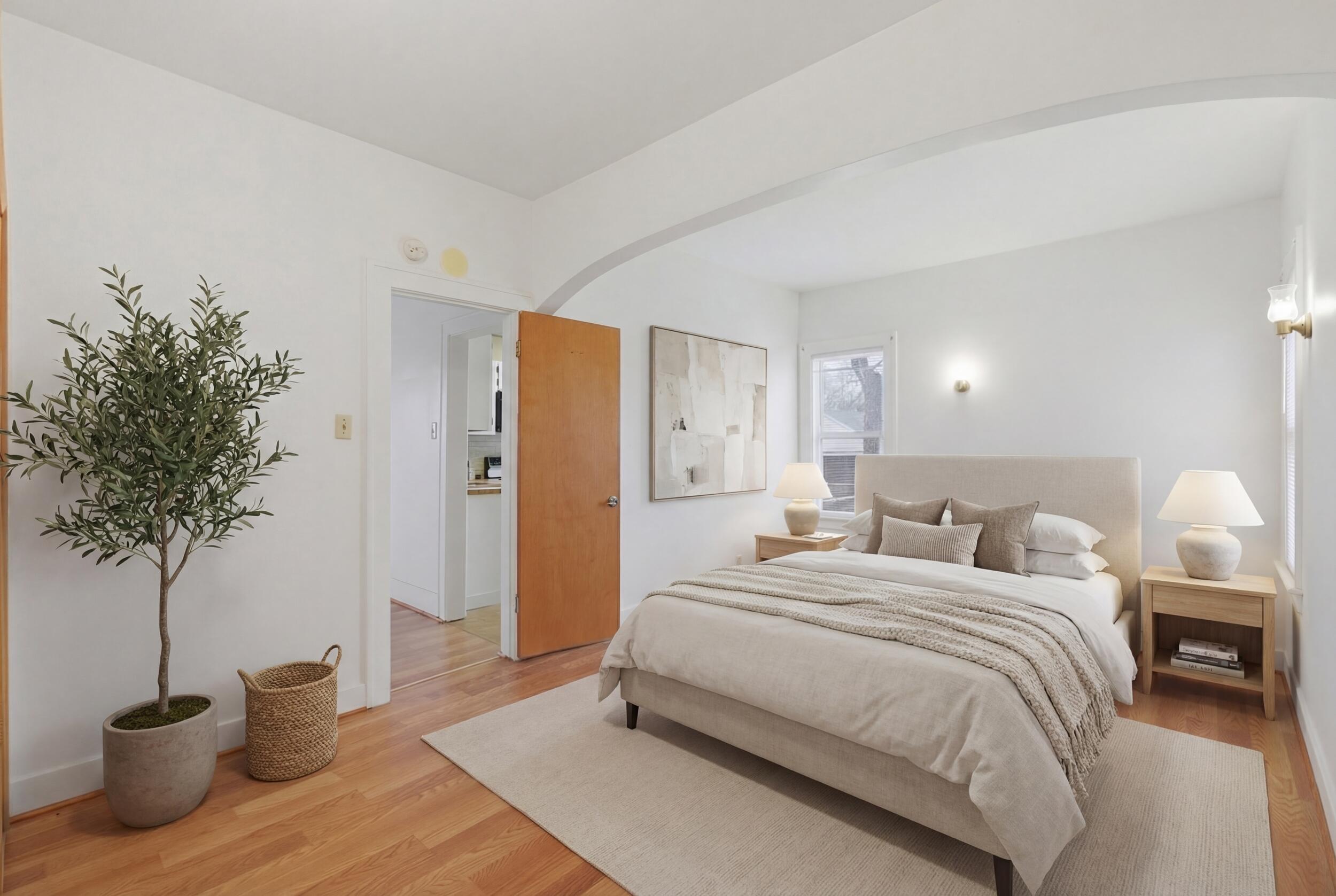 2418 Ridge Road Highland, IN 46322 - Photo 15 of 44 a bedroom with a bed and a potted plant