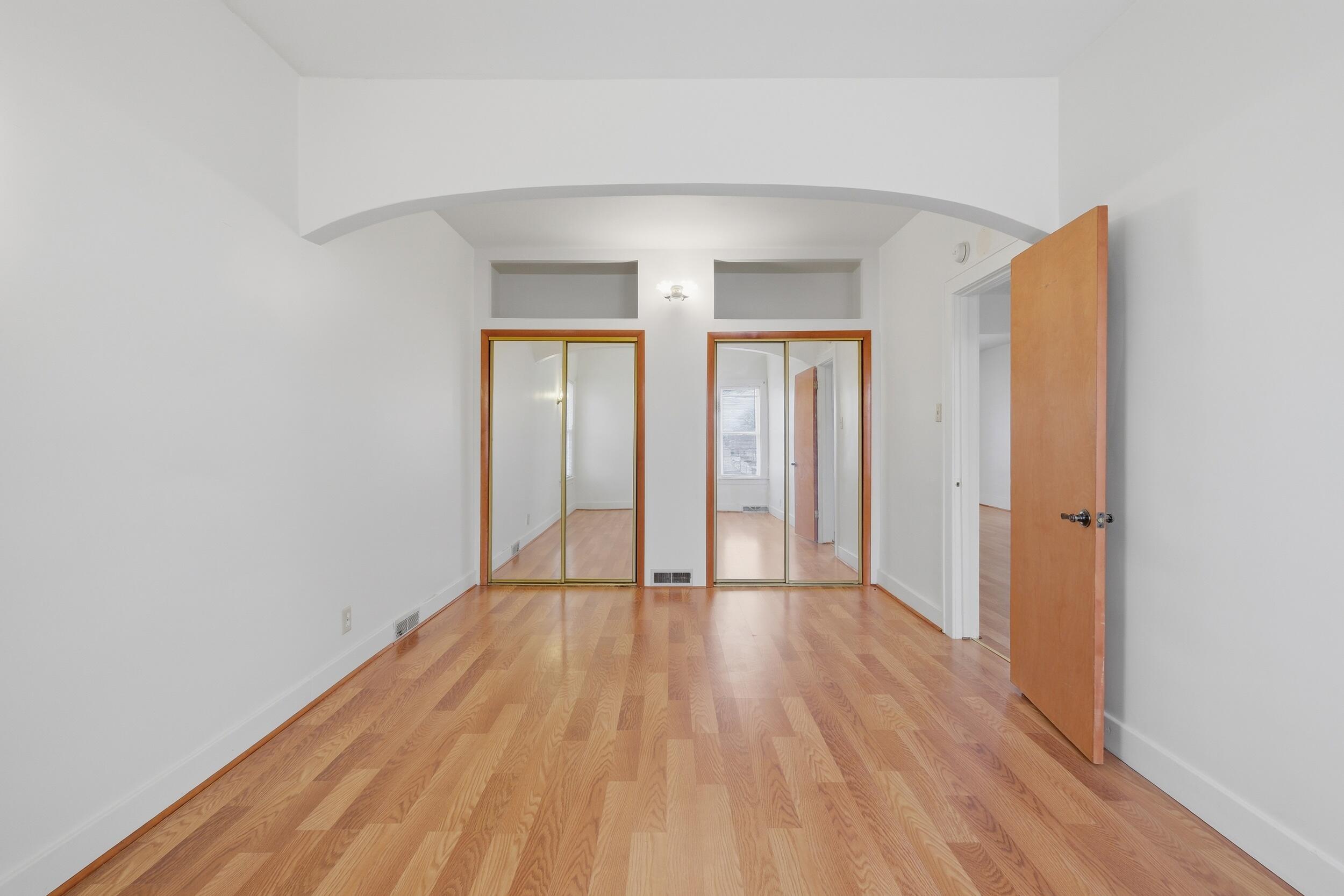 2418 Ridge Road Highland, IN 46322 - Photo 16 of 44 a view of an empty room with wooden floor and a window
