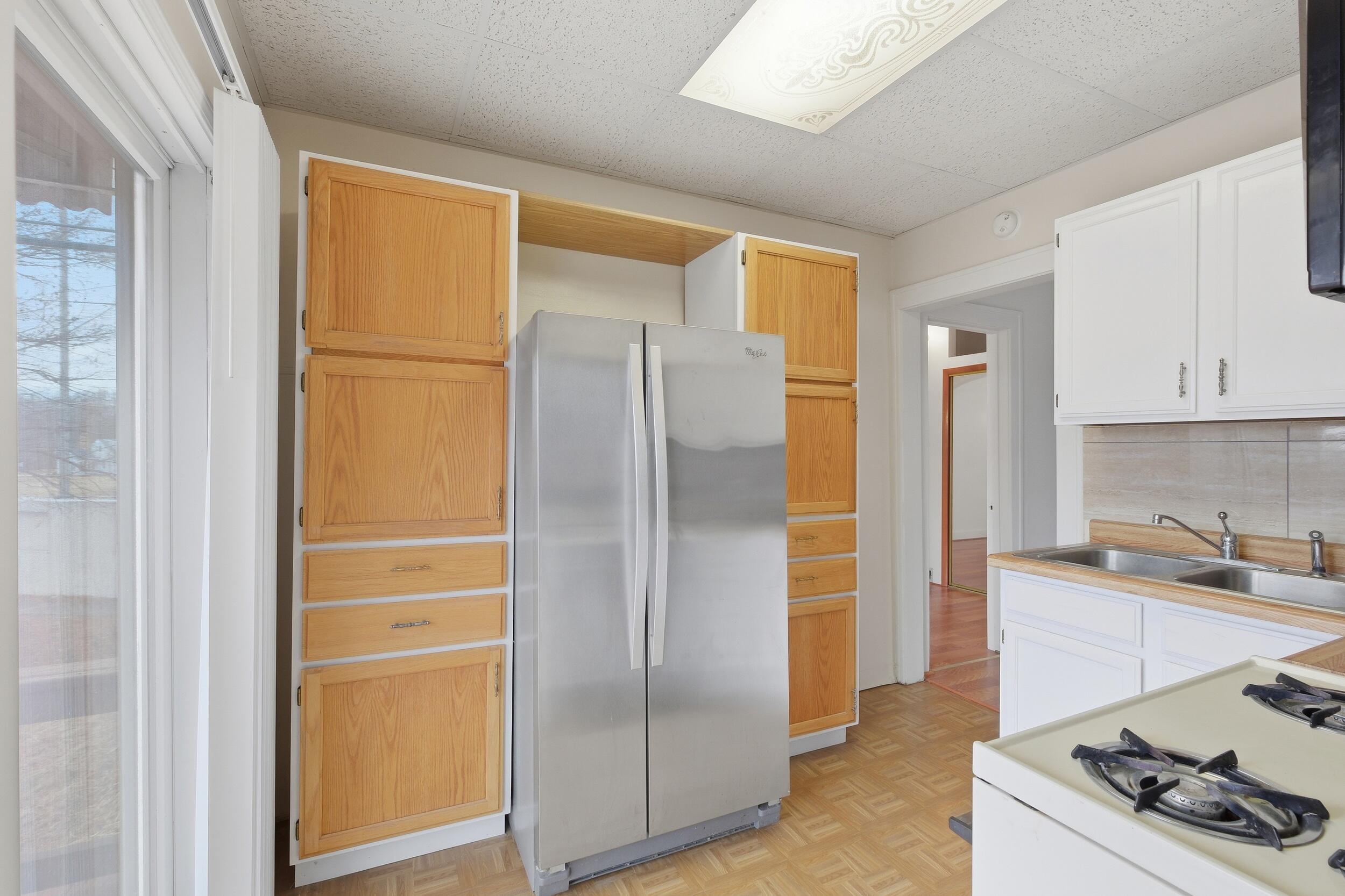 2418 Ridge Road Highland, IN 46322 - Photo 20 of 44 a kitchen with stainless steel appliances granite countertop a refrigerator and a sink