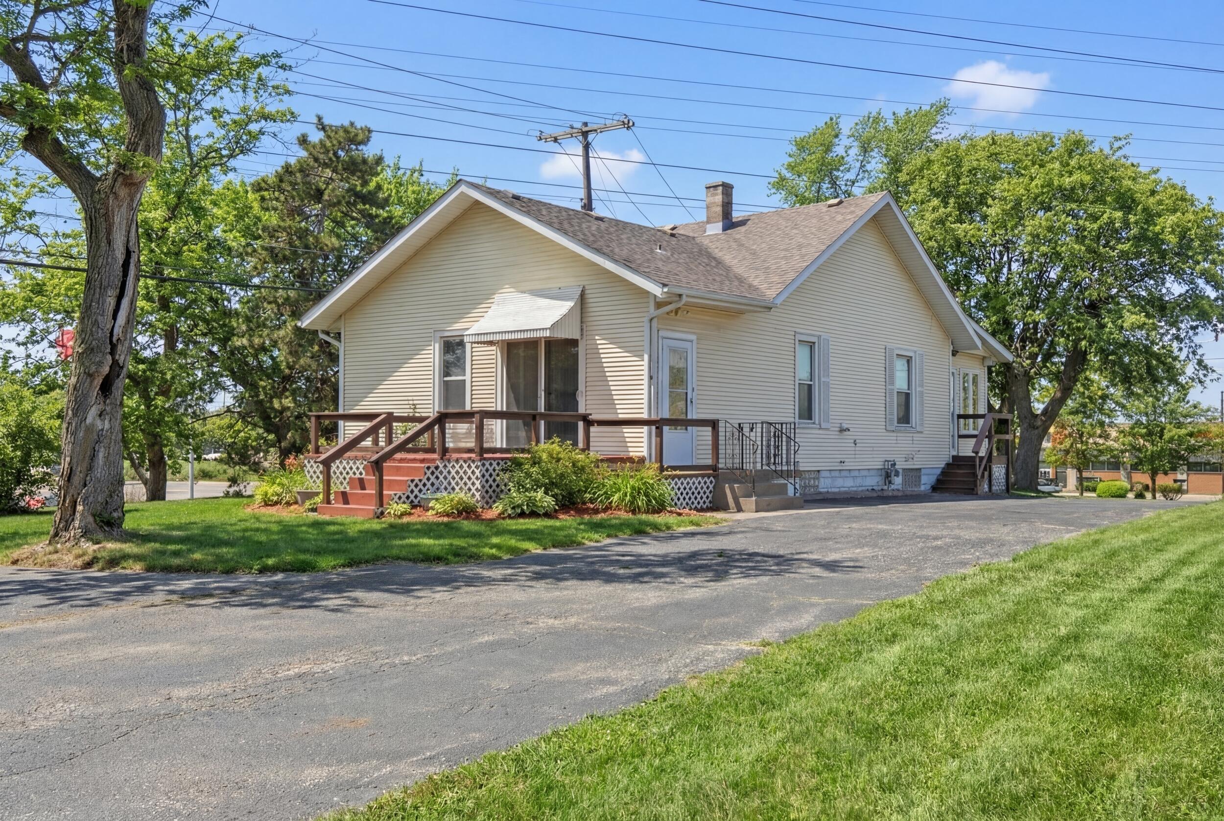 2418 Ridge Road Highland, IN 46322 - Photo 2 of 44 a view of a house with a yard and large trees