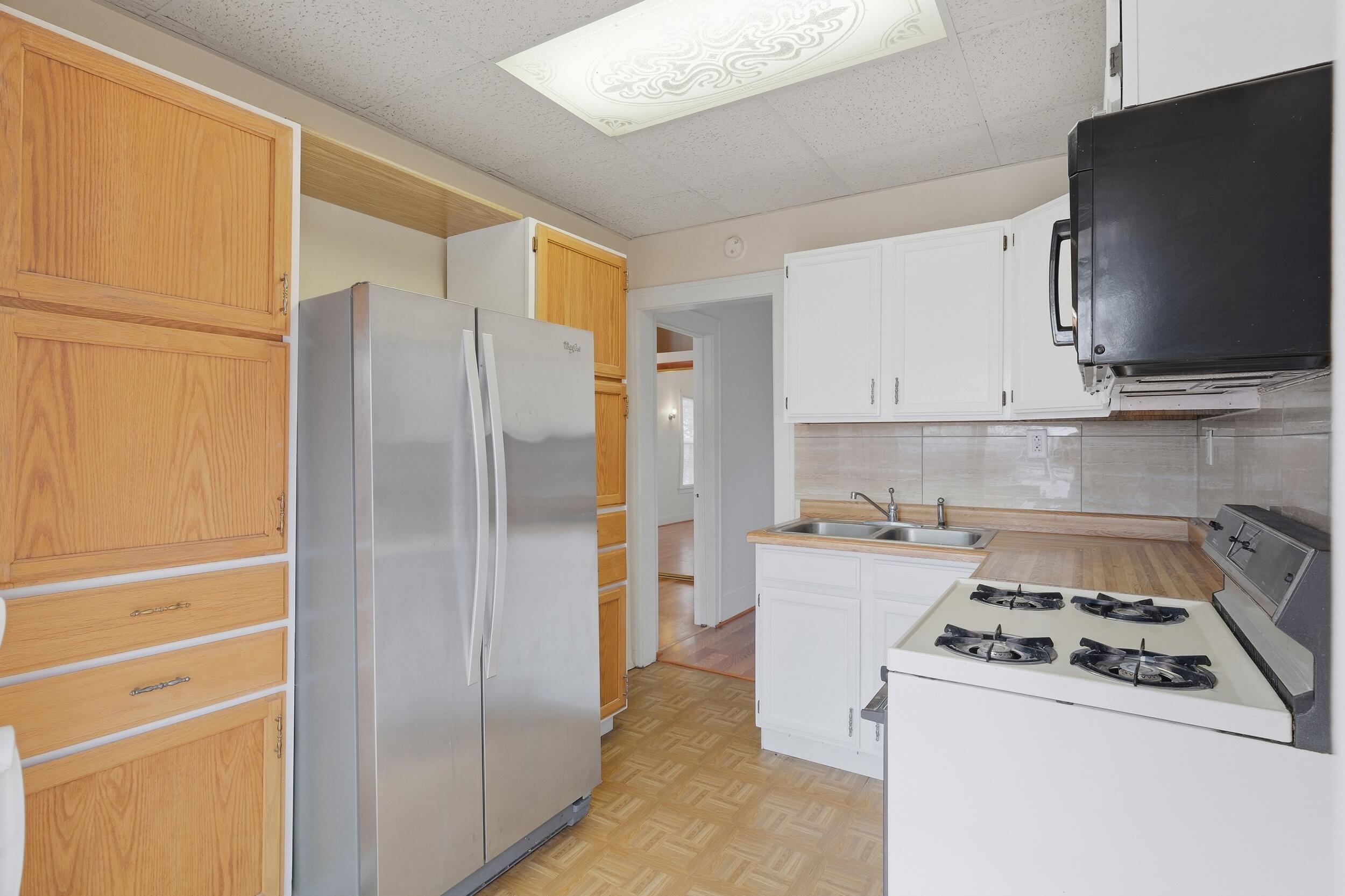2418 Ridge Road Highland, IN 46322 - Photo 21 of 44 a kitchen with a refrigerator stove and microwave