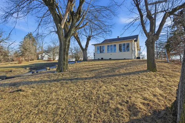 a house with a tree in front of it